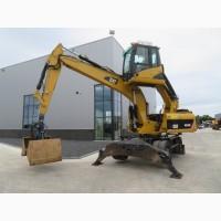 Грейферный перегружатель Caterpillar M318D